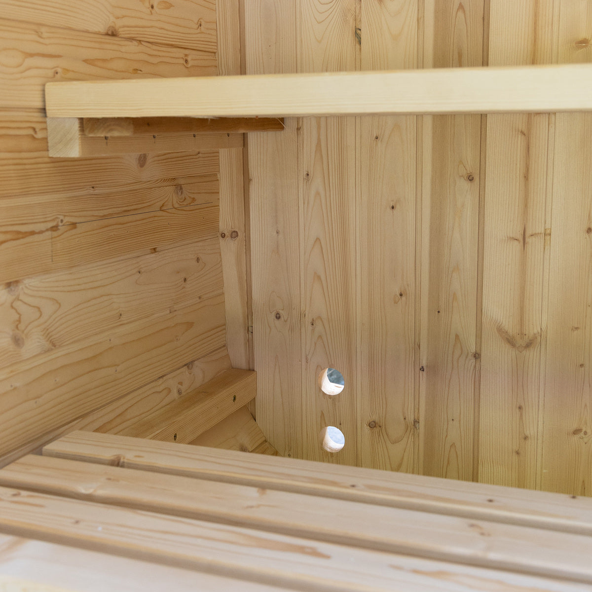 Auris One outdoor cedar sauna, bench and wall lighting detail