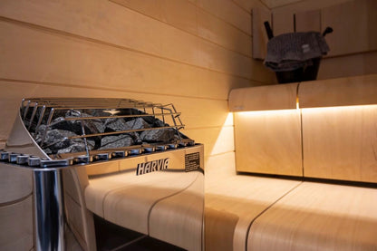 Auris One outdoor cedar sauna, Harvia heater installed beside the bench