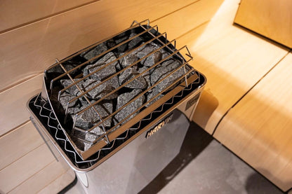 Auris One outdoor cedar sauna, close view of the heater stones